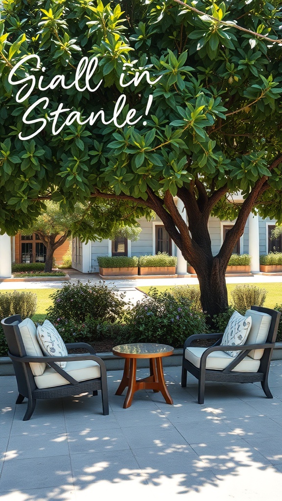 Cozy seating area under a tree with two chairs and a small table.
